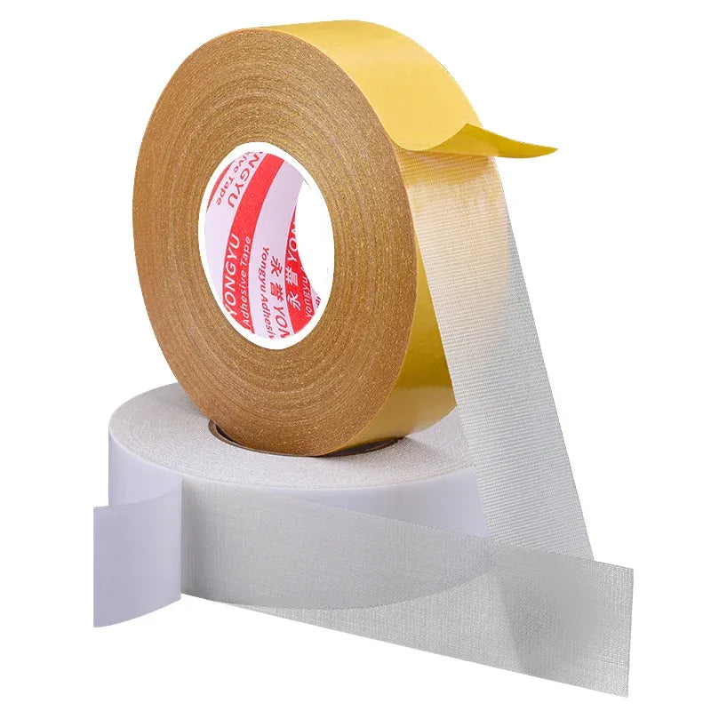 Yellow double-sided carpet tape roll with white backing strip