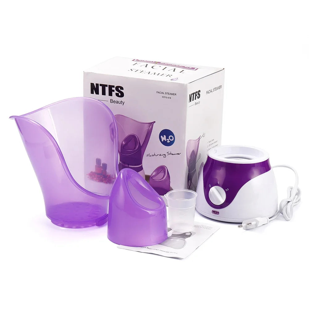 Purple and white home facial steamer set with nasal and face masks, measuring cup, and box for pore cleaning and spa.