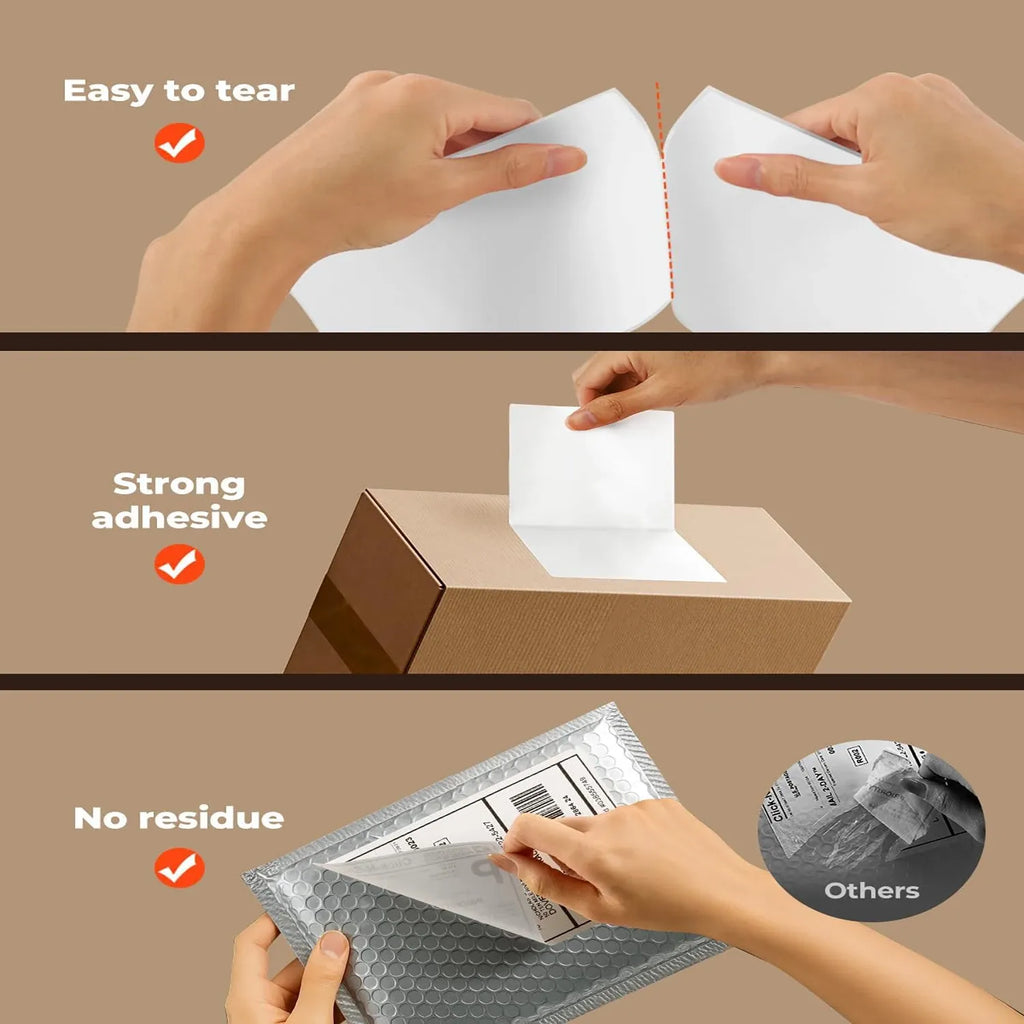 Hands applying a white label to a cardboard box with no-residue tear effect