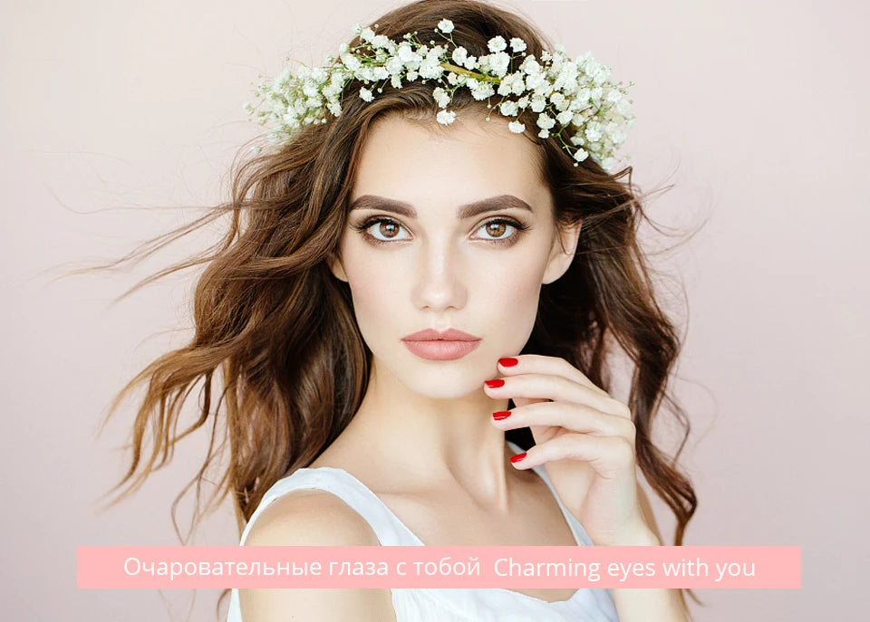 Woman with long brown hair, white floral crown, and matte nude lipstick, showing a soft, natural makeup look.