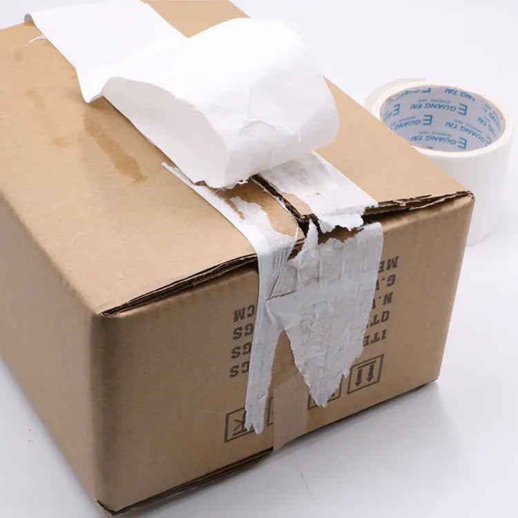 White reinforced kraft paper tape sealing box seams and corners