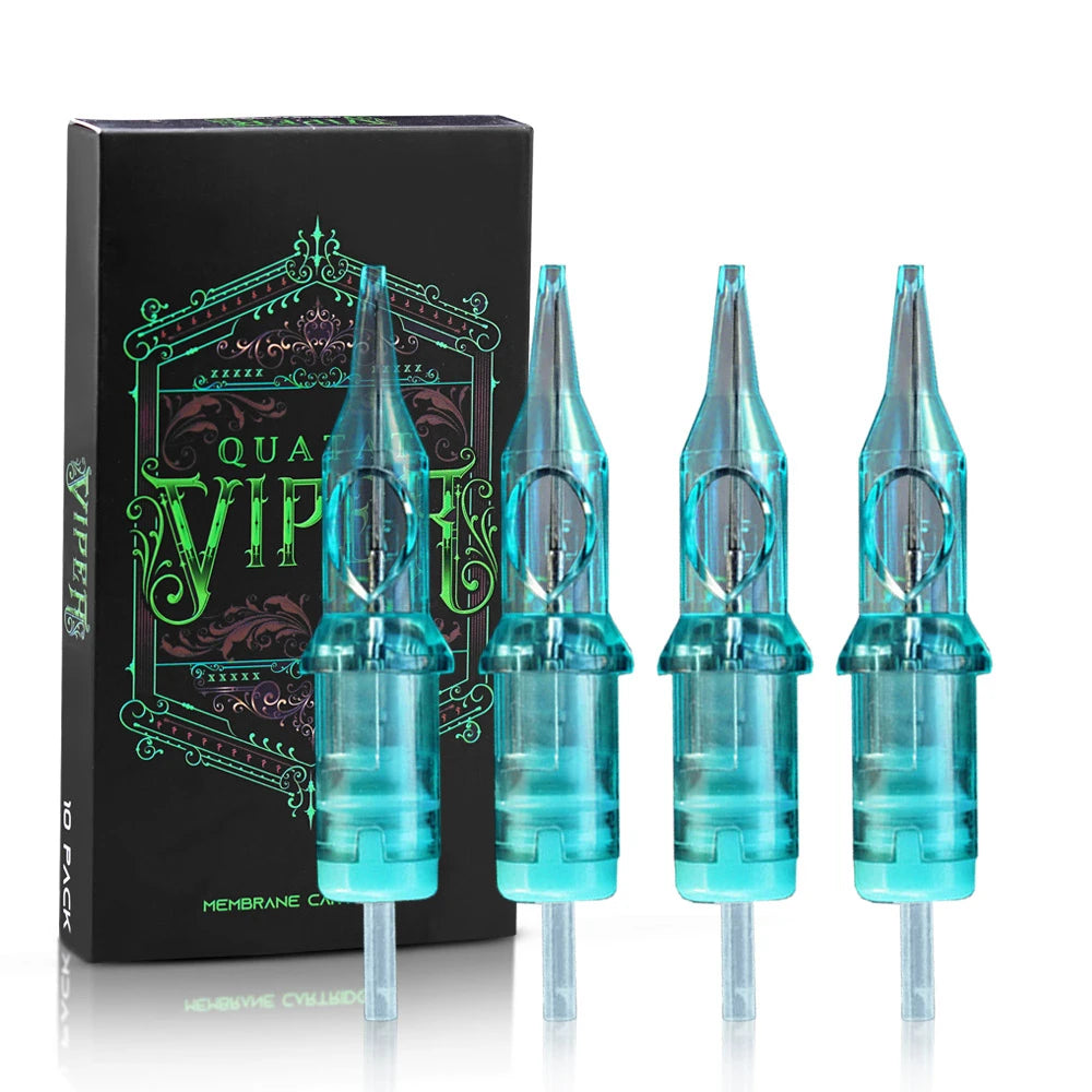Transparent blue tattoo needle cartridges with internal metal needles, standing in front of a black product box.