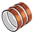 Amber polyimide Kapton tape roll close-up with clear liner and dark border