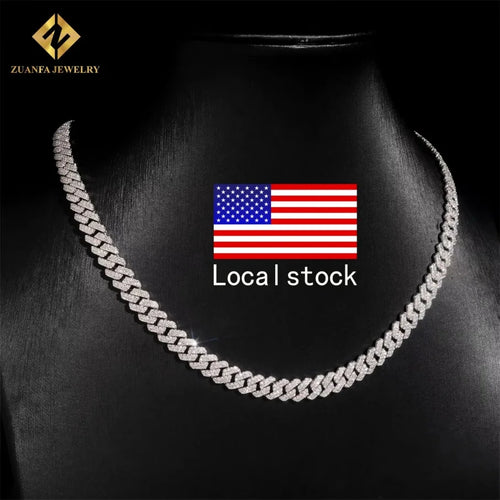 Iced out silver cuban link chain necklace with pave micro-set diamonds on a black jewelry display bust.