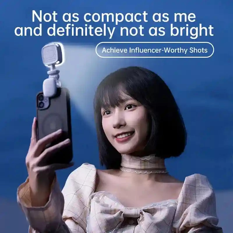 Small, white, square clip-on LED phone light illuminating a person taking a selfie.