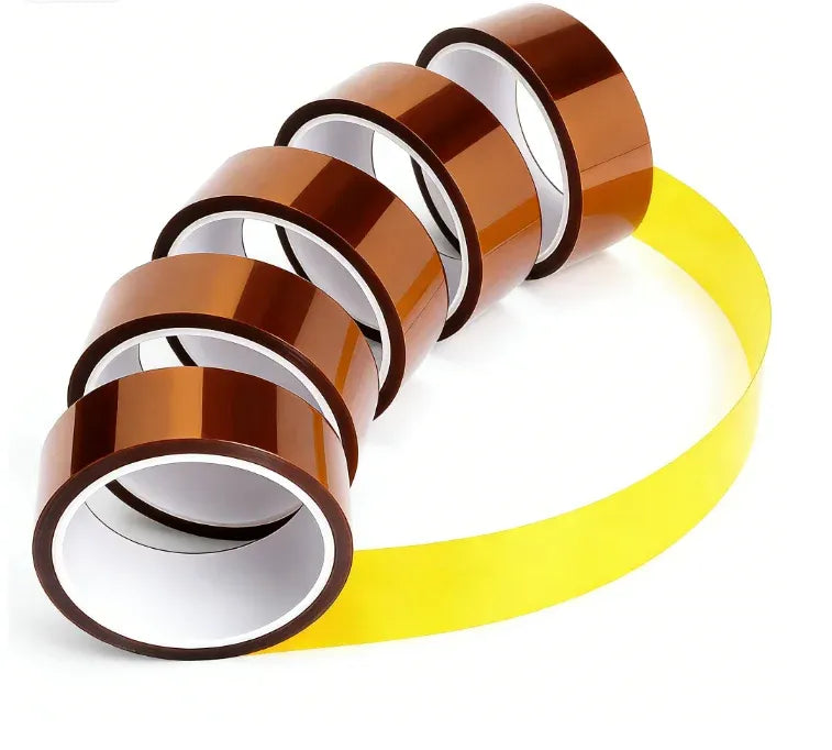 Curled brown polyimide insulating tape rolls and a long yellow strip