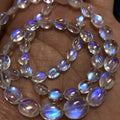 Blue fire rainbow moonstone oval briolette bead strands on hand