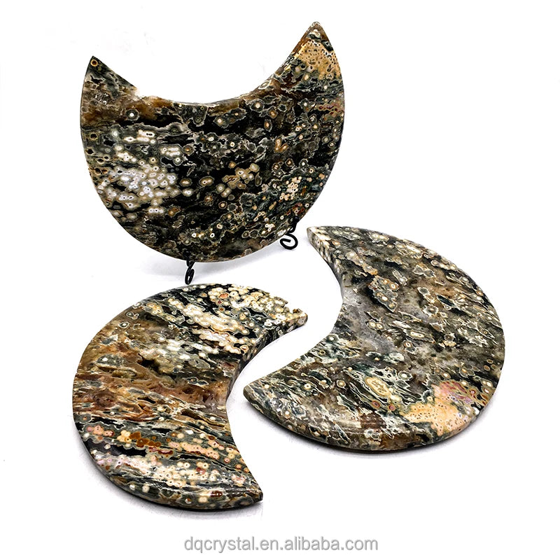 Set of three ocean jasper crescent moon crystals on black stands, speckled druzy surfaces