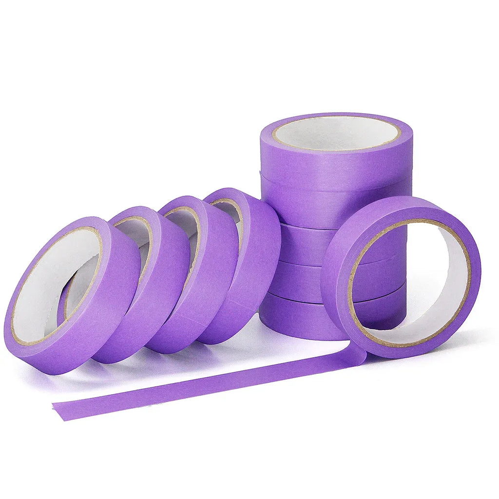 Purple masking tape rolls with extended strip, several rolls in a row.