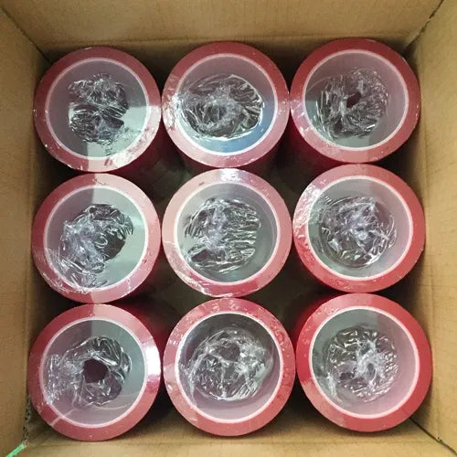 Multiple red security seal void tape rolls with tamper-evident VOID text on the outer layer