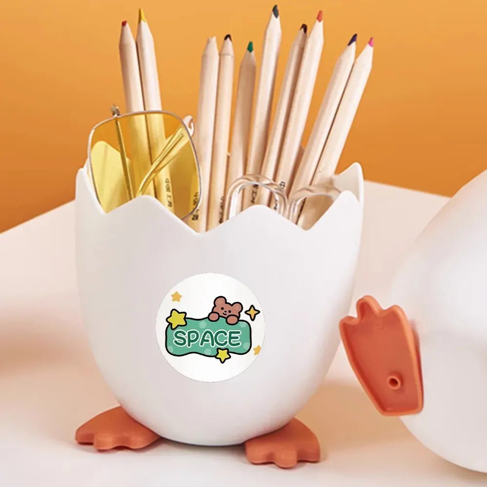 Cute round space animal reward sticker on a white pencil cup