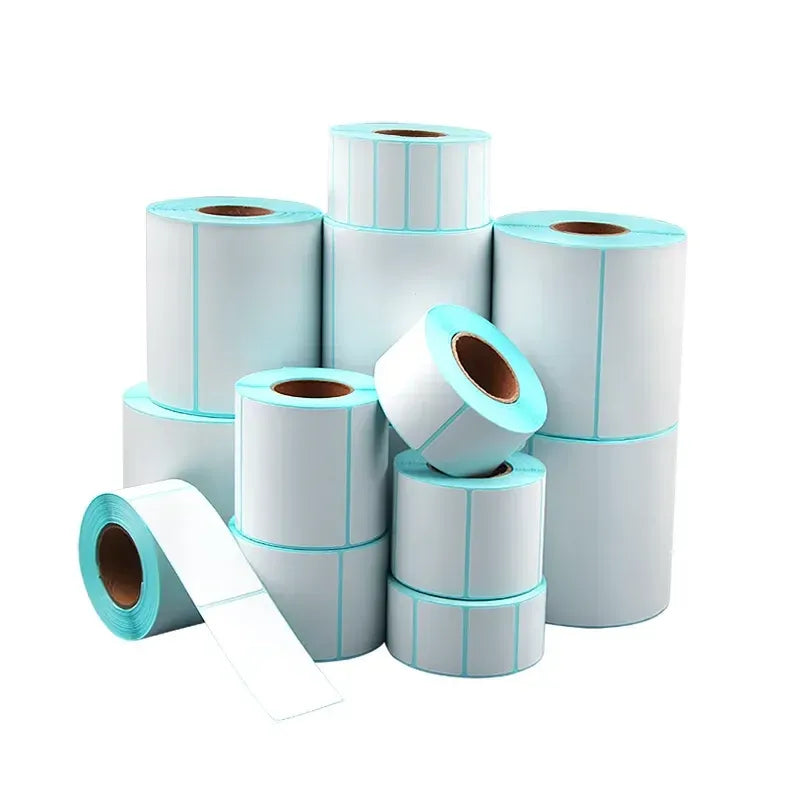 Stacked sky blue and white direct thermal label rolls with visible cores
