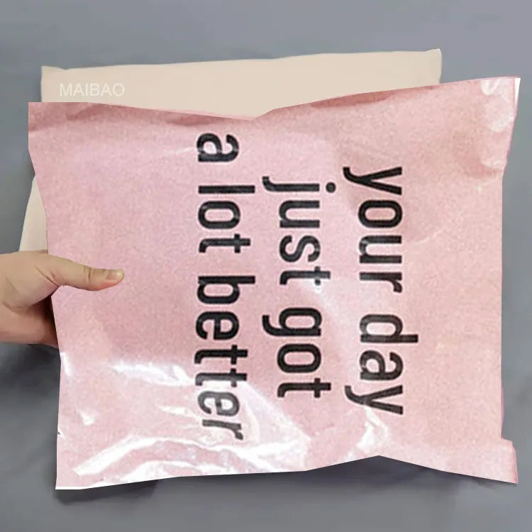 Pink poly mailer bag with “your logo” text in large dark letters