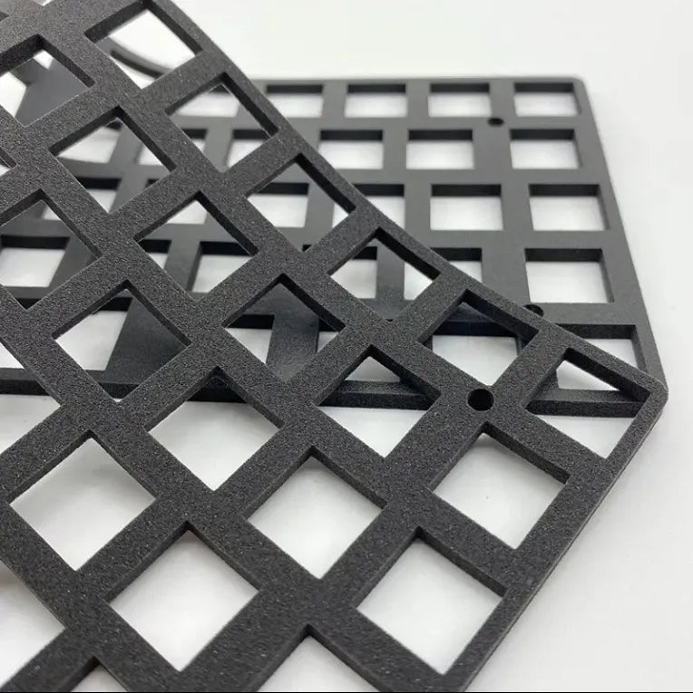 Black double-sided urethane foam tape sheet with square cutout pattern