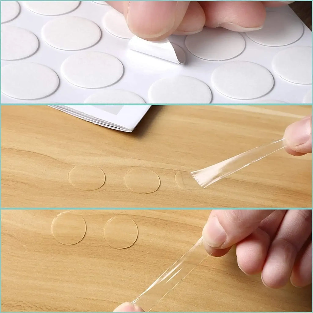 Hand applying transparent double-sided glue dots to wood with thin adhesive film