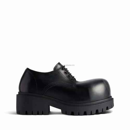 Luxury black leather lace-up platform loafer with a chunky lug sole and oversized round toe silhouette.