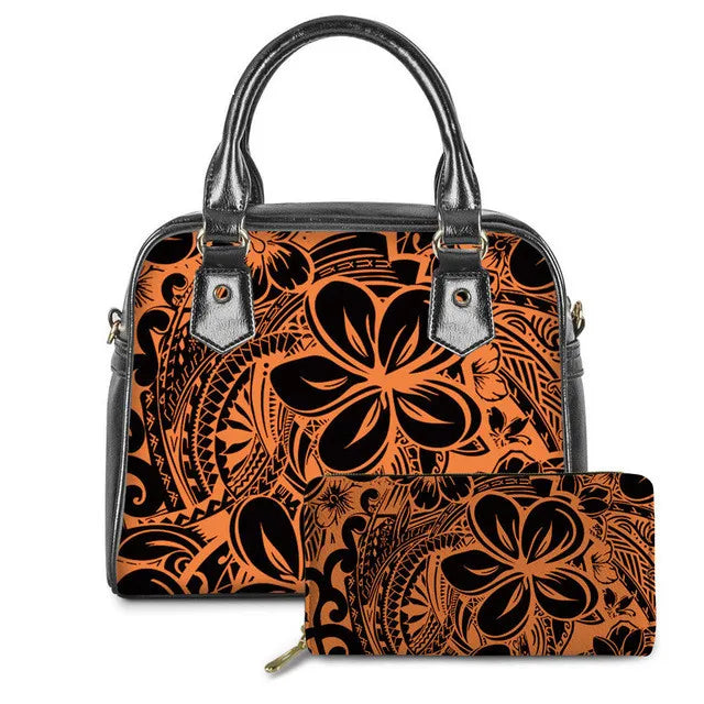Black and orange PU leather handbag and matching wallet featuring a vintage Polynesian tribal print and floral design.