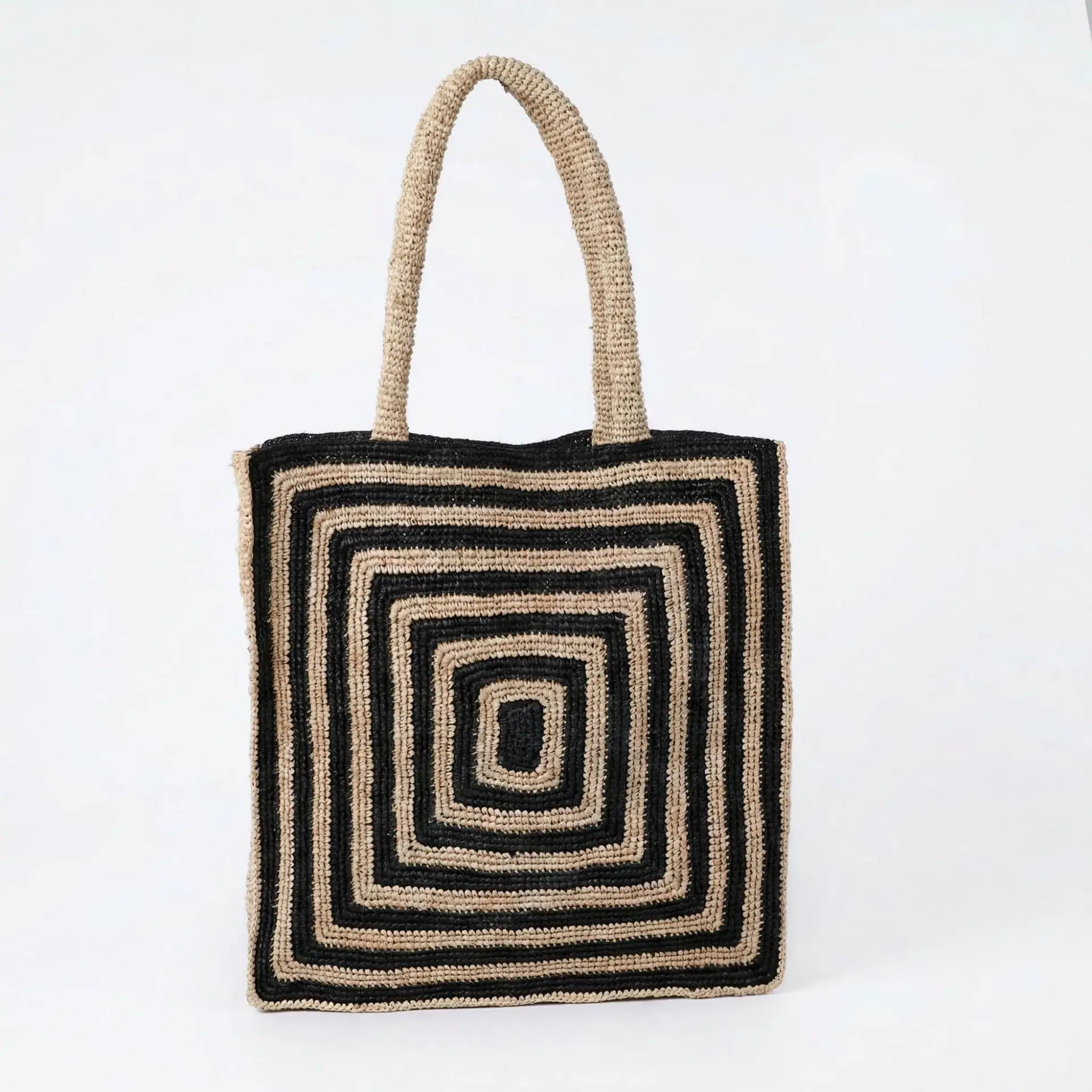 Lightweight crochet tote bag with black and beige concentric square patterns, ideal for daily use or beach carry.