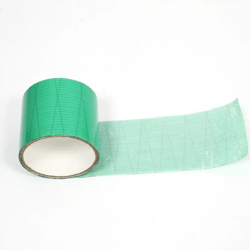 Green waterproof membrane tape roll with long strip featuring grid markings