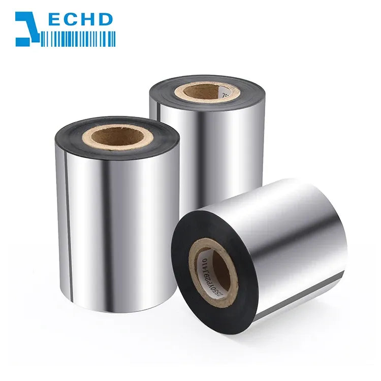Barcode ribbon rolls with black outer rim and brown inner core, angled view