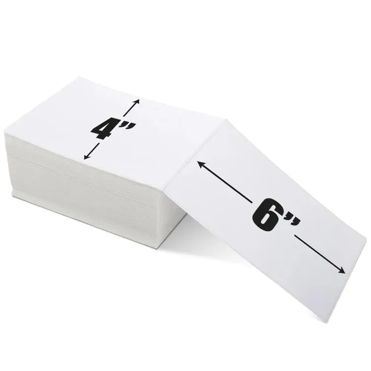 White thermal label fanfold stack showing 4 in and 6 in size markings