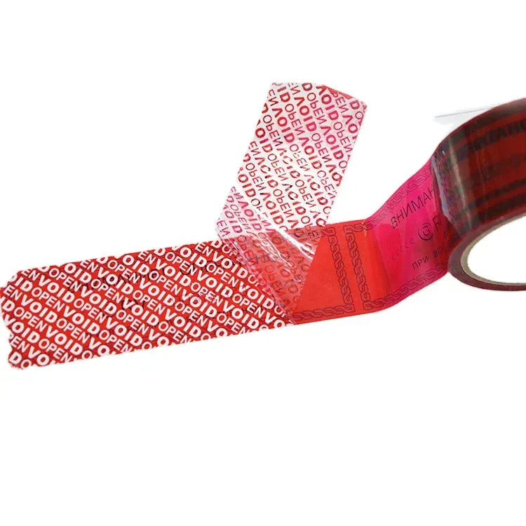 Red security seal void tape with tamper-evident VOID text on partially unrolled tape