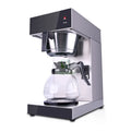 Commercial Bunn stainless steel coffee maker with glass decanter and brewing indicator light on white background.