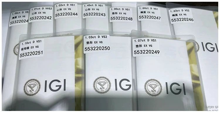Set of IGI diamond report labels in tray with stamped certificate numbers