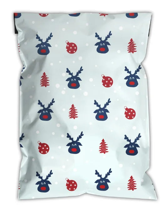 Light blue Christmas poly mailer with reindeer faces, red berries and snowflake dots pattern