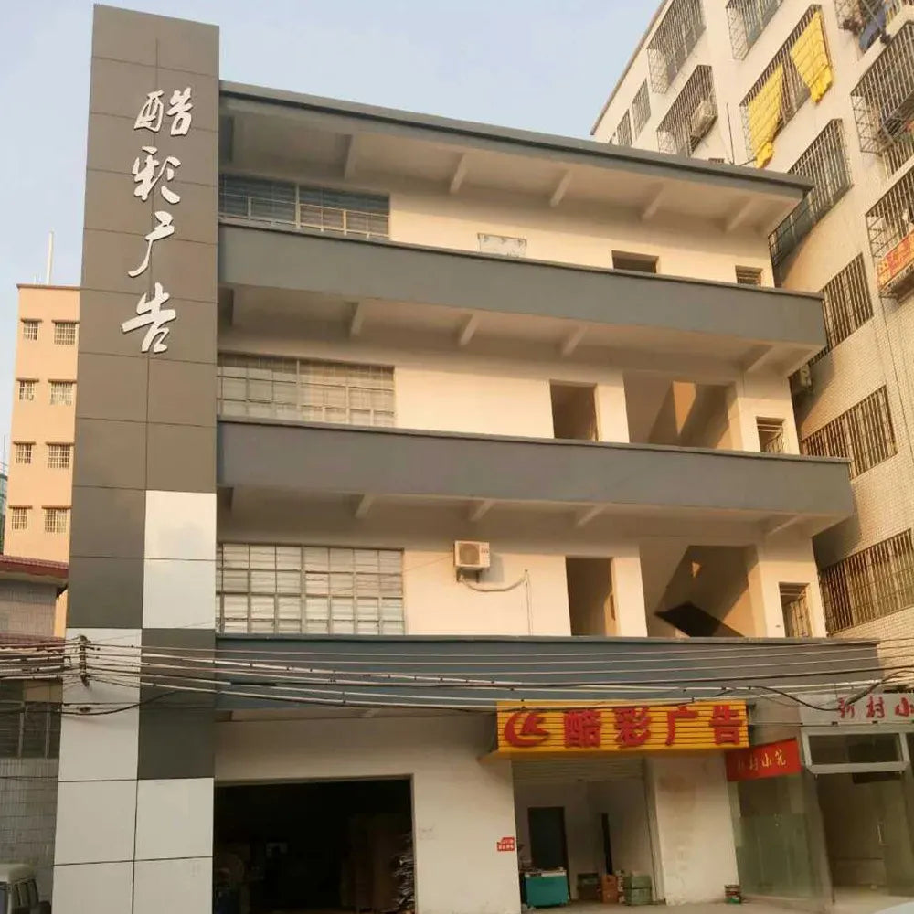 Factory building exterior with storefront signage for printing services