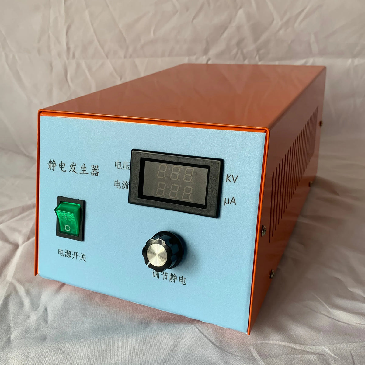 Static charge generator control box with digital meter, green power switch, and kV mA labels