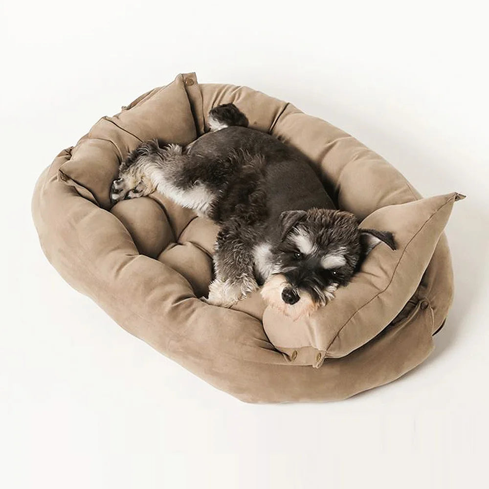 Dog resting on a cozy, tan plush sofa bed. Soft, warm pet mattress for small to large dogs for winter comfort.
