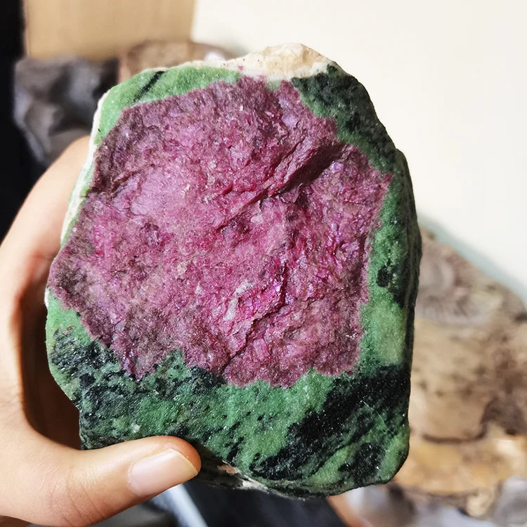 Close-up rough red-and-green quartz stone with textured crystalline face