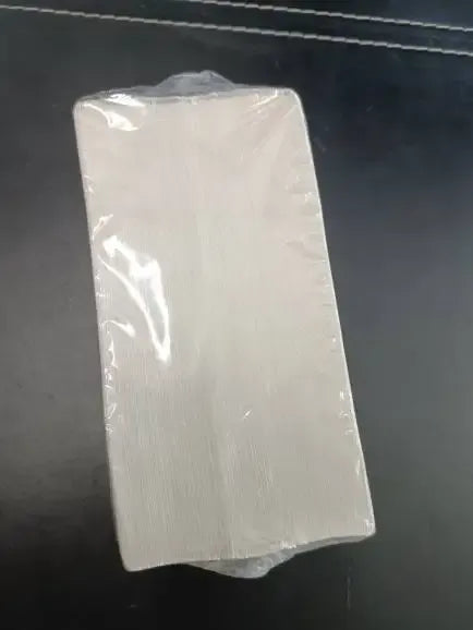 Sealed pack of white thermal label sheets under clear plastic wrap