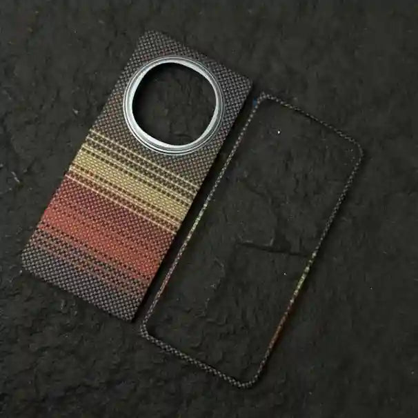 Textured adhesive phone camera protector and frame featuring a woven fabric pattern in red, gold, and dark gray.