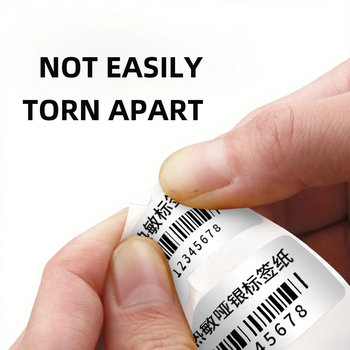 Peel-and-stick thermal label strip with barcode, held by fingers