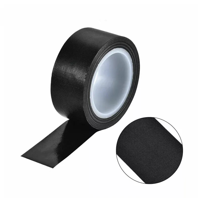 Black PTFE-coated cloth tape roll with loose cut end and textured surface