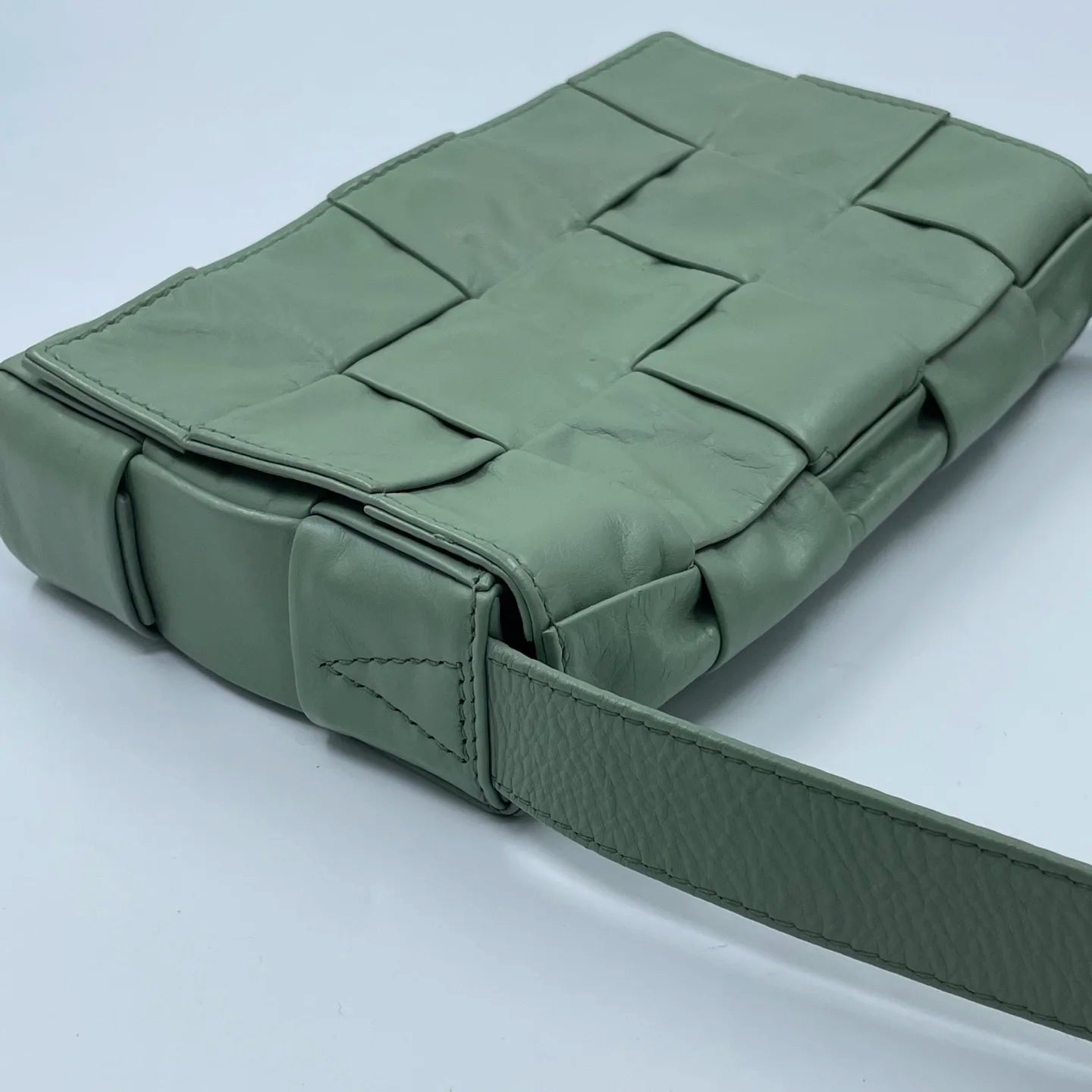 Light green woven leather designer shoulder bag with wide intrecciato pattern, pre-owned luxury fashion piece.