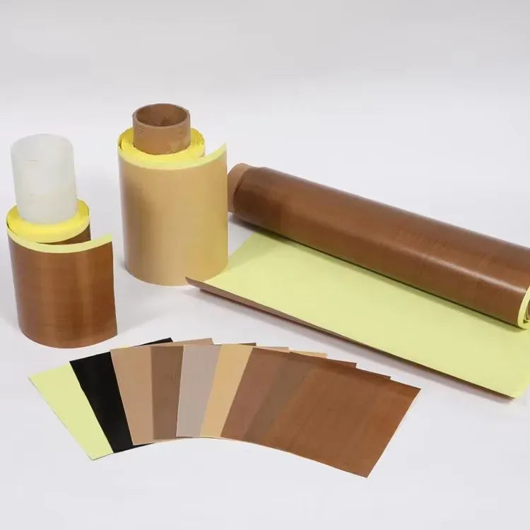 Brown and yellow PTFE-coated tape rolls with stacked cut pieces