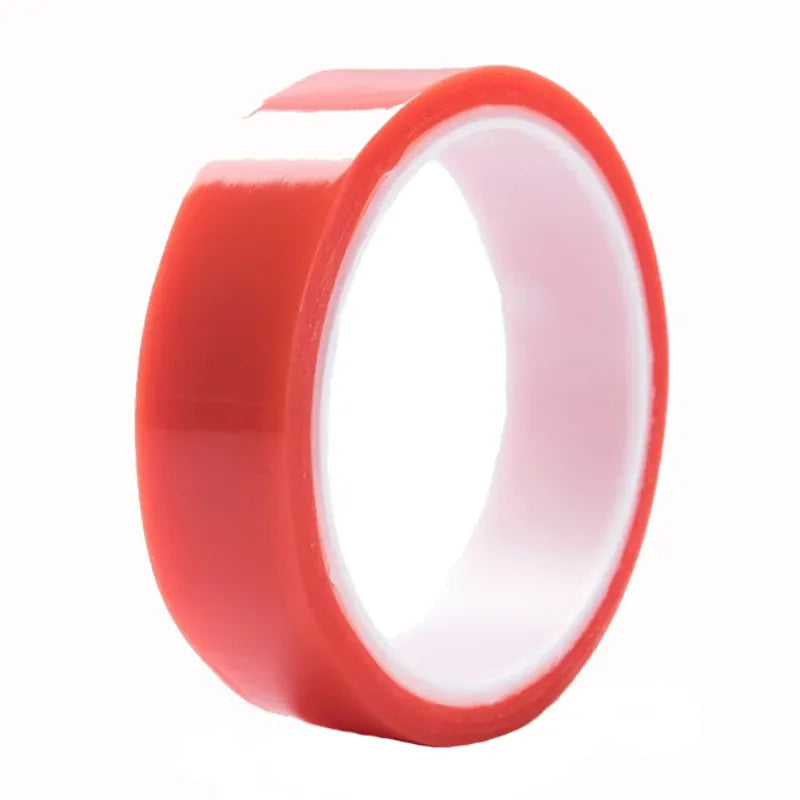 Red double-sided polyester tape roll with a loose adhesive strip extending outward