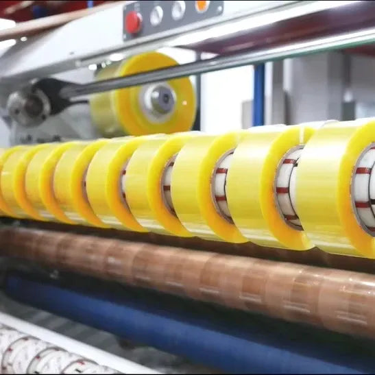Yellow BOPP packing tape on an industrial dispenser for sealing