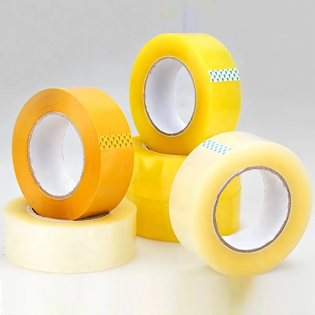 Mixed yellow and orange packing tape rolls, three rolls with open cores