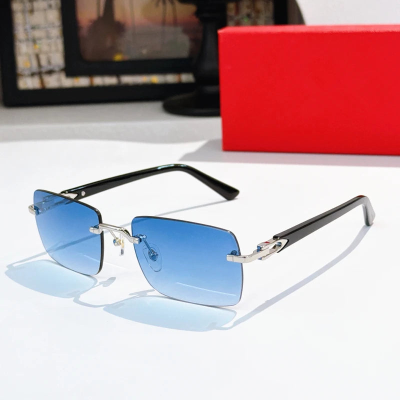 Luxury rimless rectangular sunglasses with blue gradient lenses, silver titanium bridge, and black acetate temples.