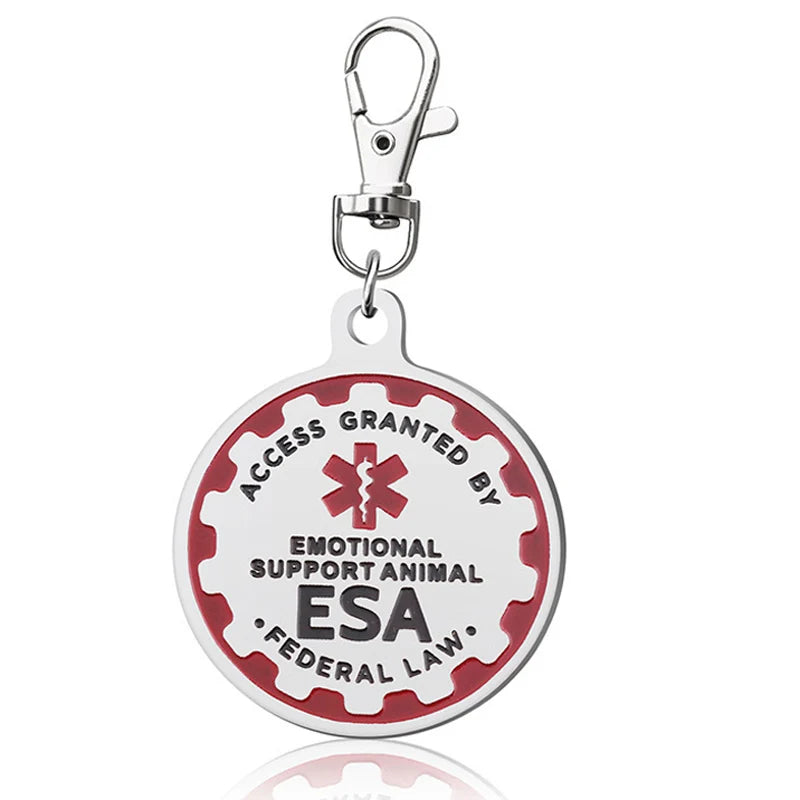 Silver metal Emotional Support Animal (ESA) tag with red gear border and clip for easy attachment to dog collars.