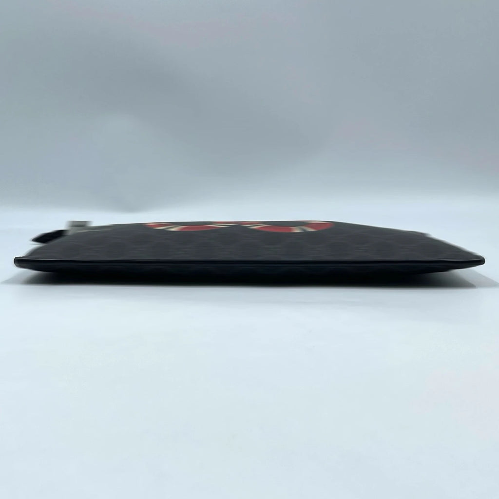 Second-hand black canvas designer clutch wallet with red snake graphic print, slim handheld unisex design.