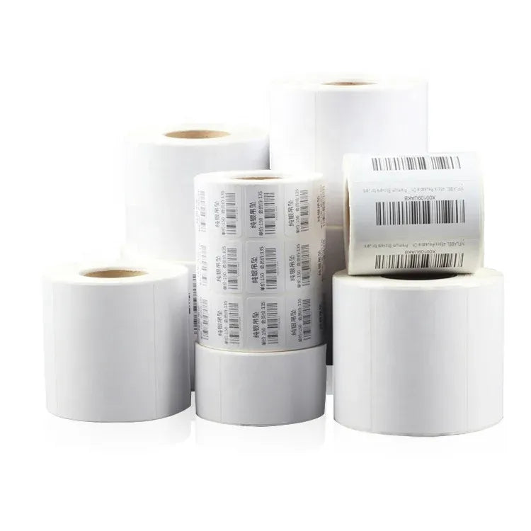 White thermal barcode label rolls, stacked with printed barcode strips
