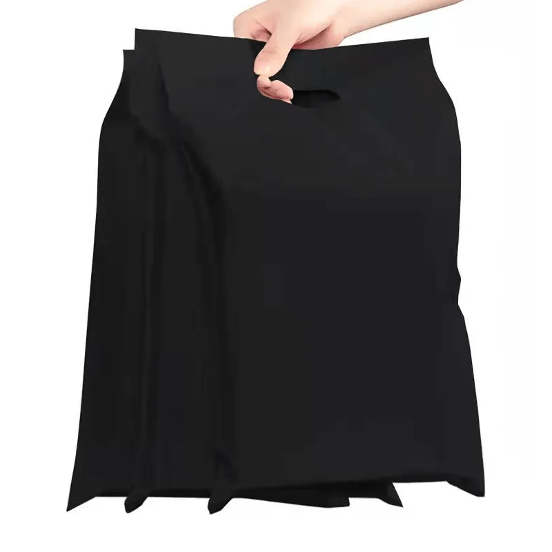 Black poly mailer bag with handle, held for packing
