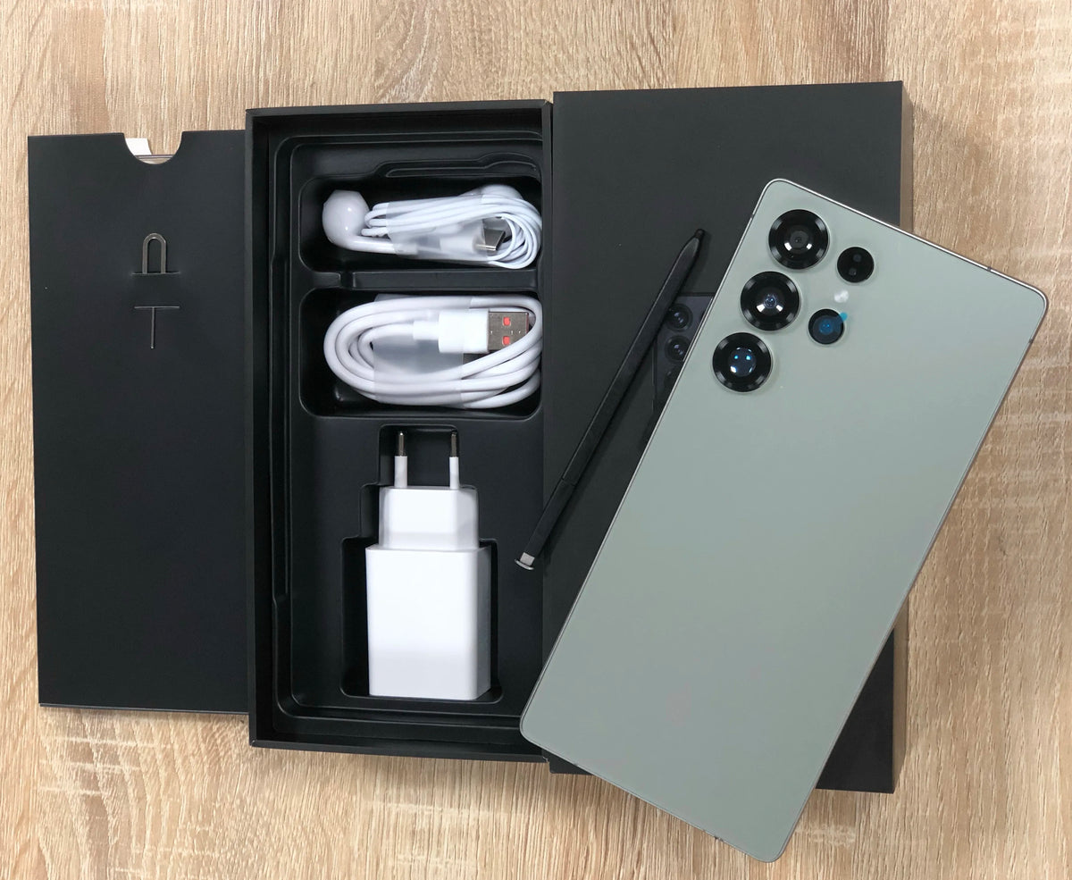 Green-gray smartphone and retail box with cables and charging adapter
