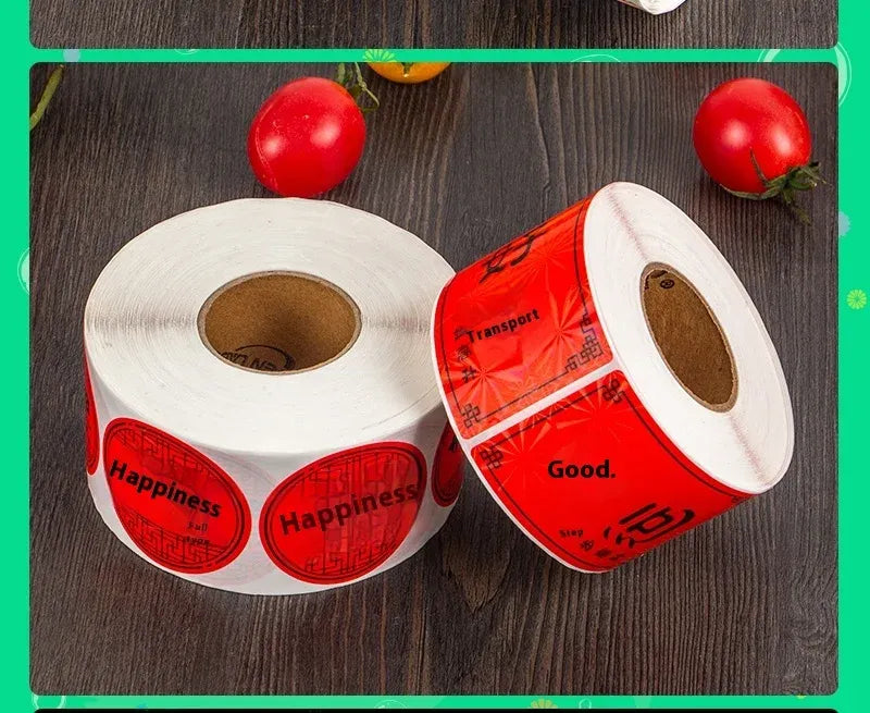 Adhesive label sticker roll with red Happiness round labels and fruit icons