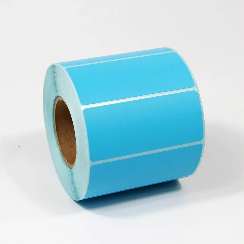 Blue self-adhesive thermal label stock roll with blank rectangular labels